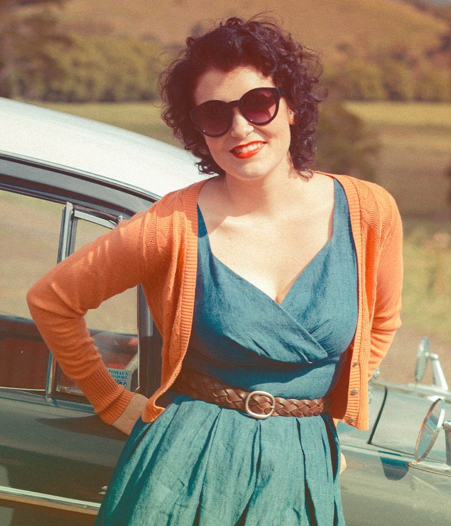 Woman Smiling and Standing Next to Vintage Car